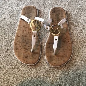 MK White & gold flip flops